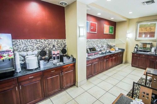 comfort suites near airport free breakfast area