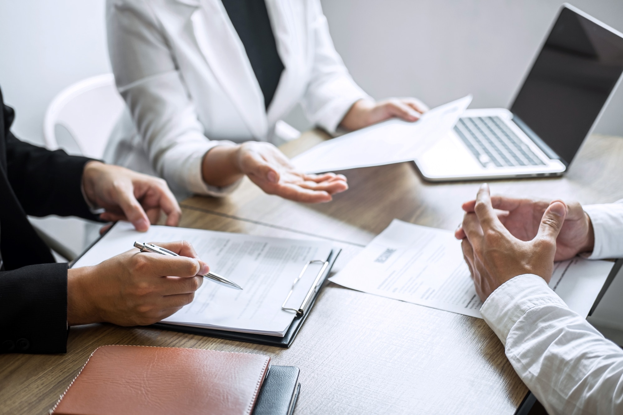 A team in an office discussing Microsoft Search during a meeting