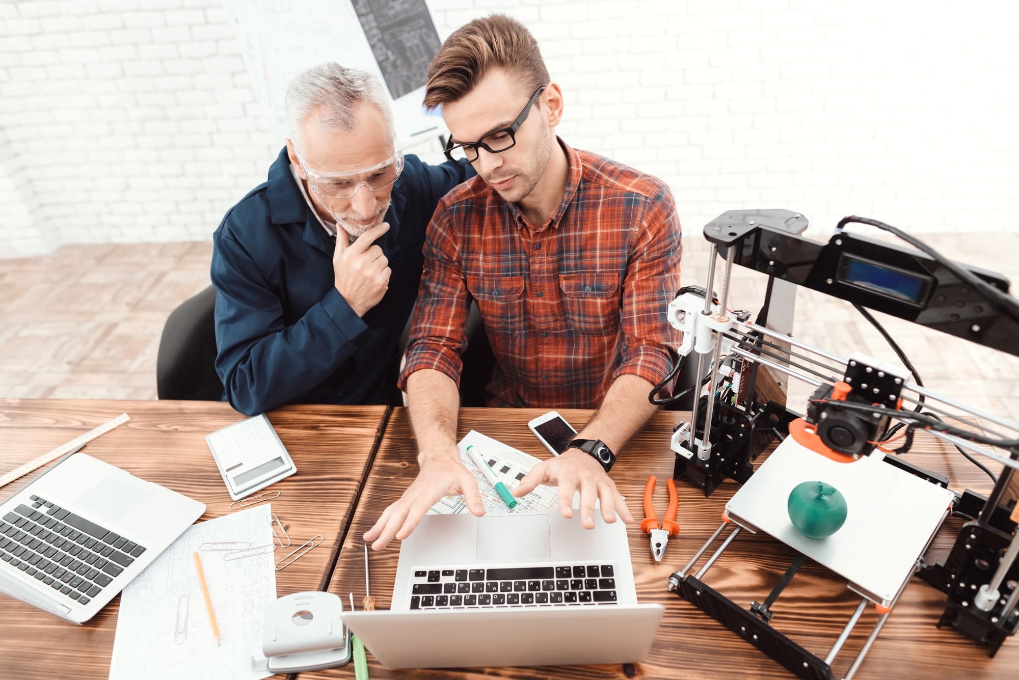 Two men in an office researching Microsoft search on their computers